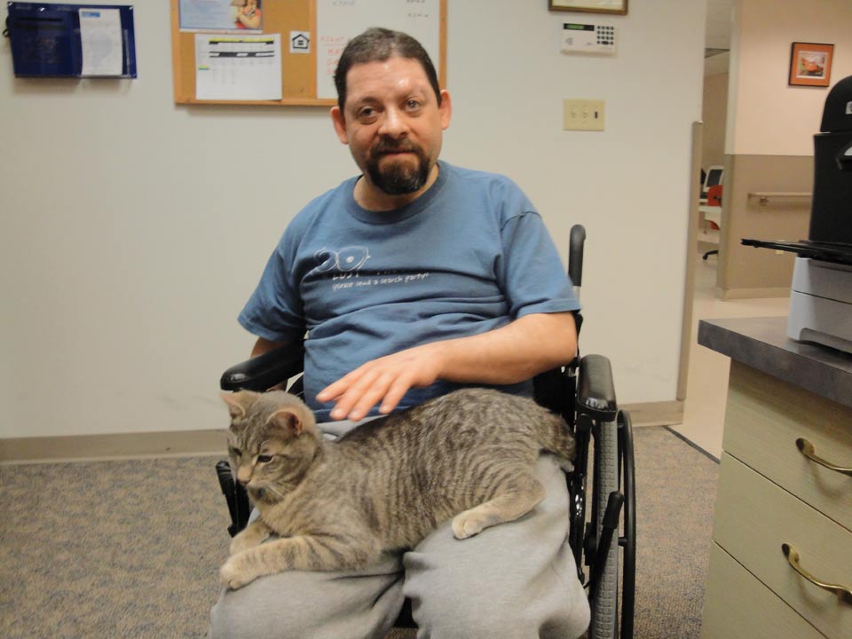 Peach Tree resident with Cuddles, the cat.