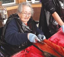 Resident cutting salmon