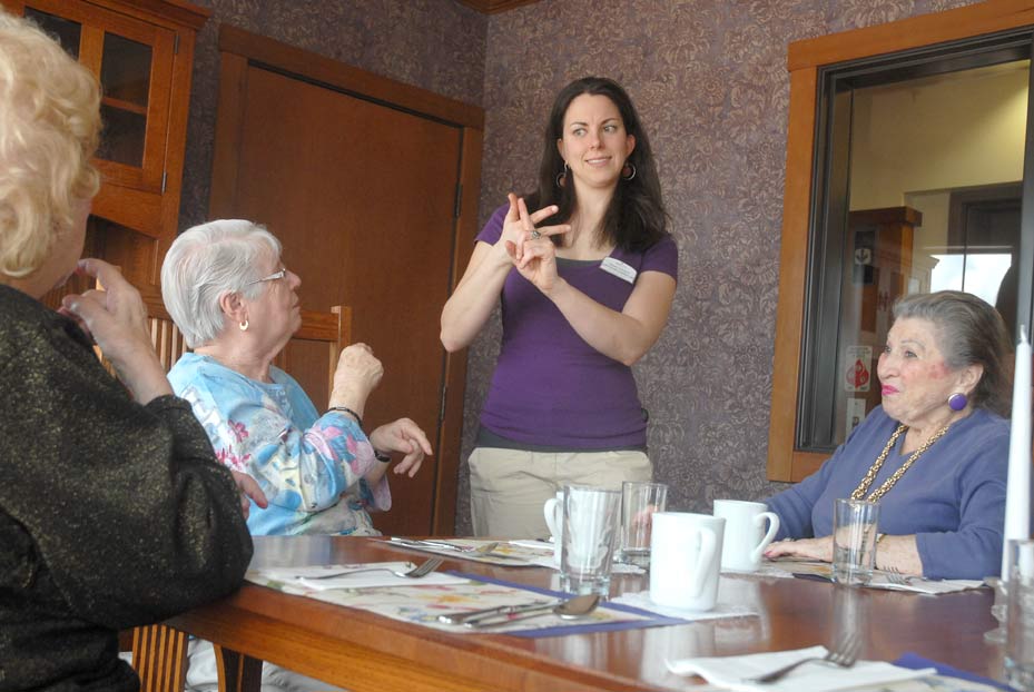 Chestnut Lane staff and residents using ASL.