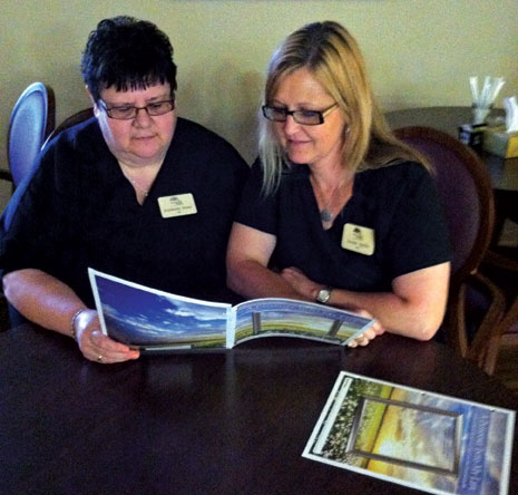 Staff members review a resident's Passport.